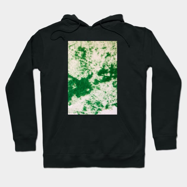 Green felt disbursed on a white surface Hoodie by textural